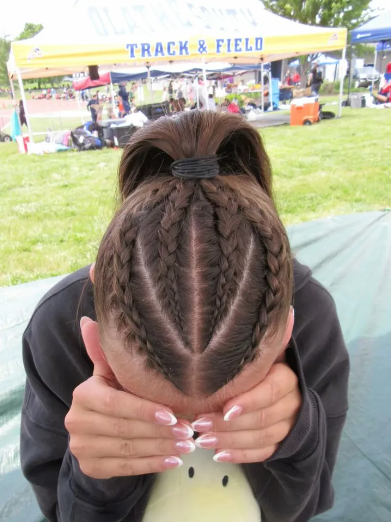 feed-in braids bun style softball hairstyle