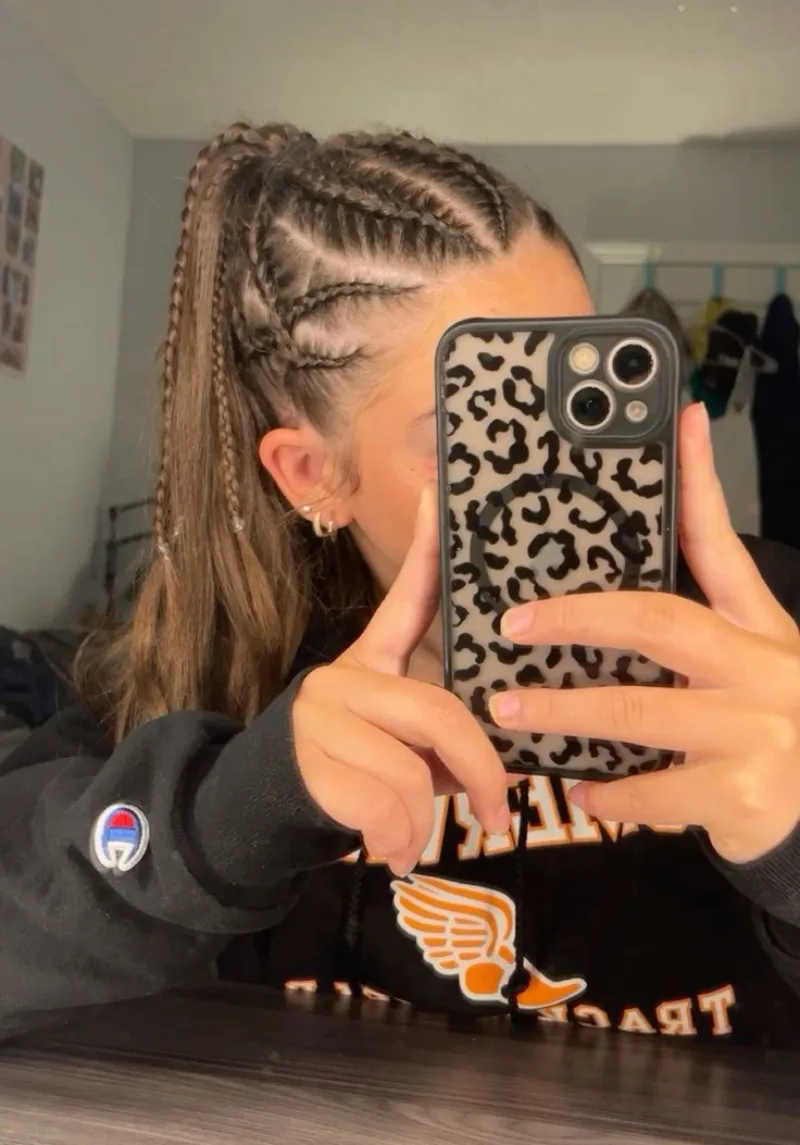 side cornrow ponytail softball hairstyle