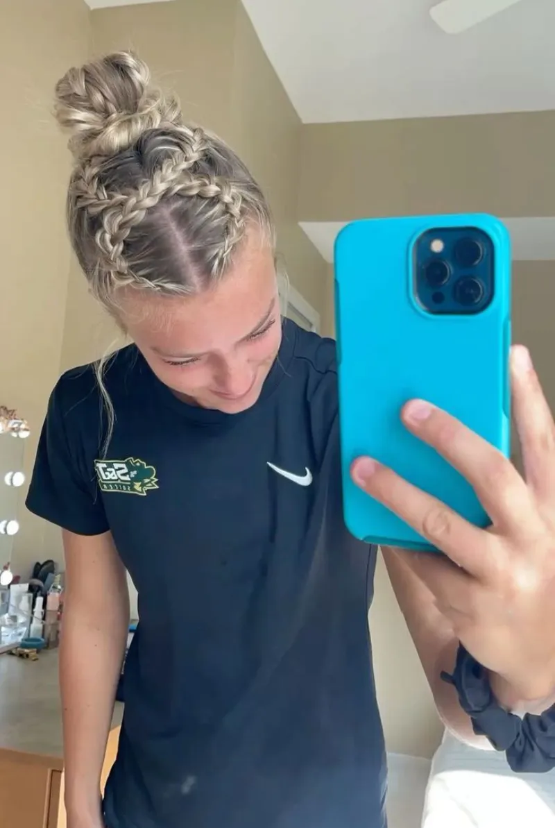 mirror selfie braided bun softball hairstyle