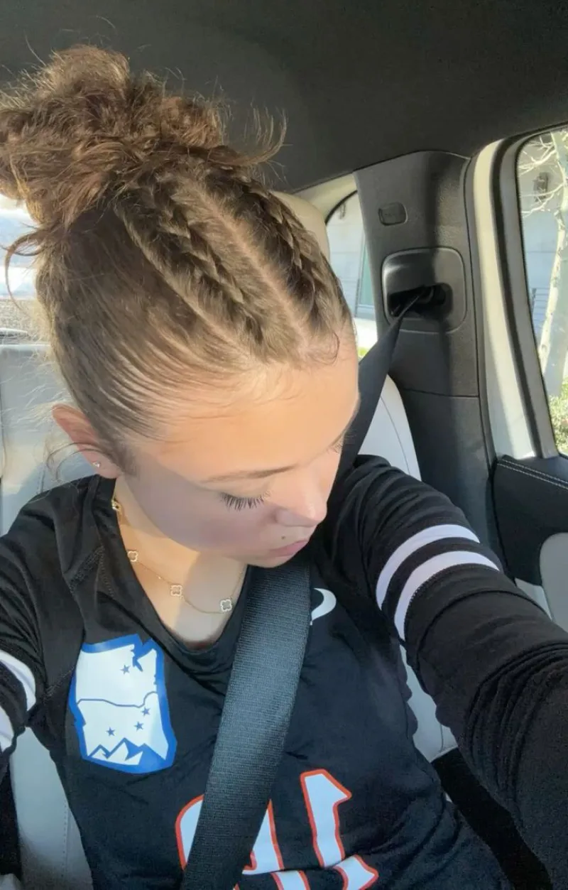 driving day braided bun softball hairstyle