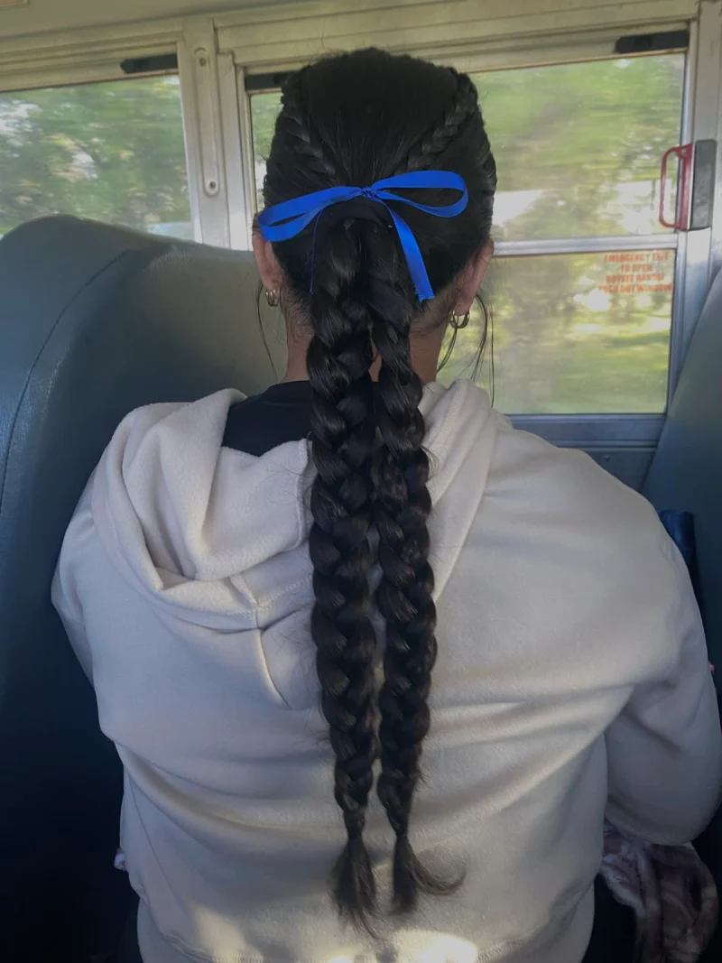 classic single braid with ribbon softball hairstyle