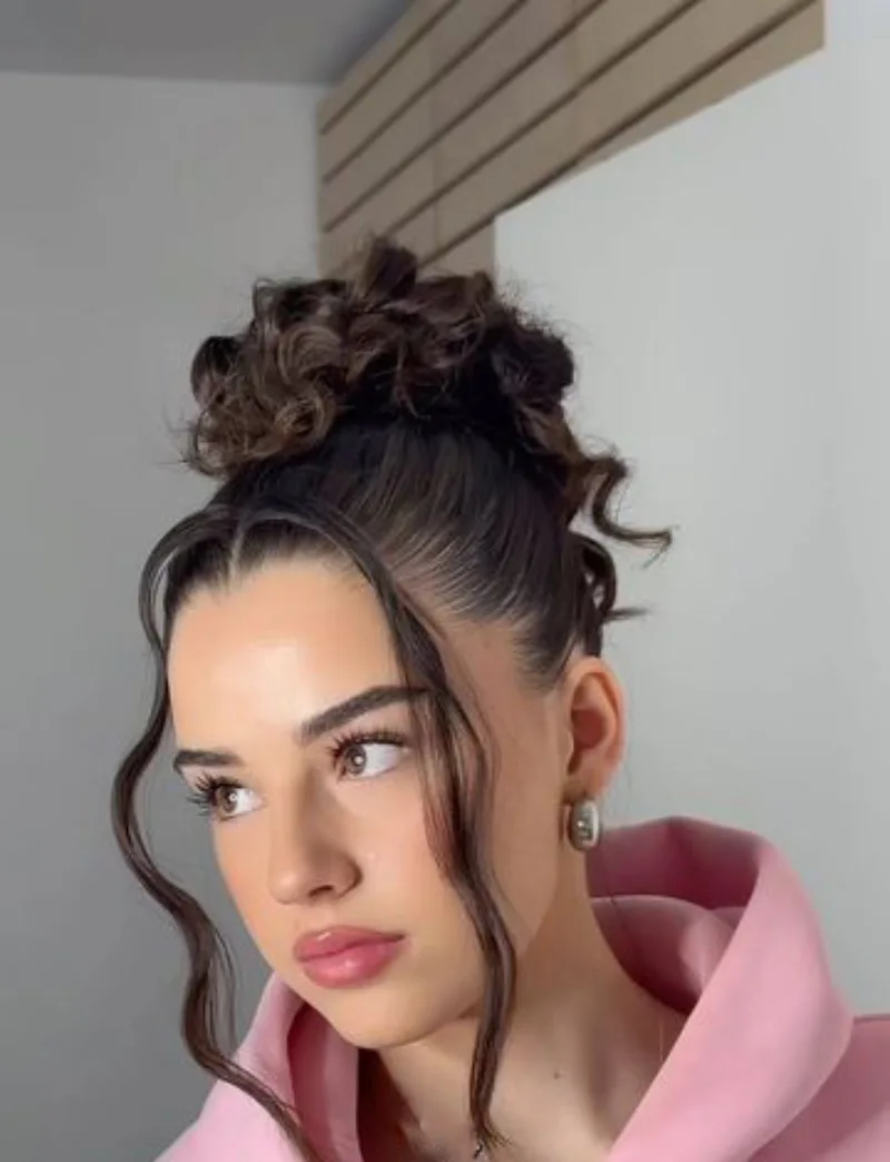 High Curly Bun with Tendrils Hairstyle for School