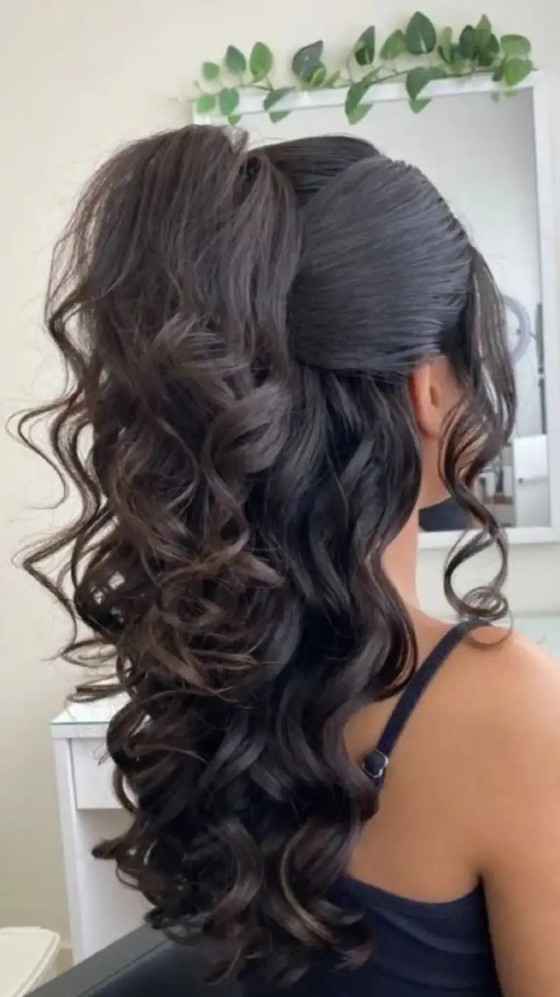 Voluminous High Ponytail with Curls homecoming hairstyle