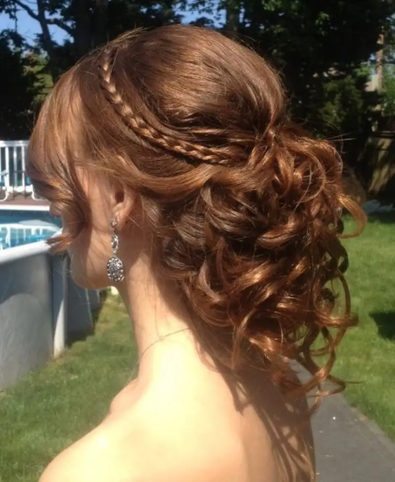 Low Side Bun with Soft Curls homecoming hairstyle