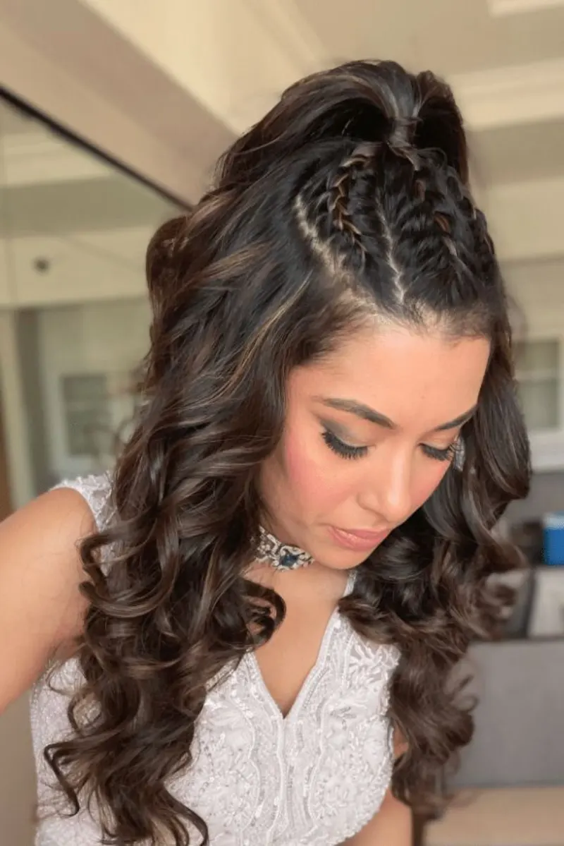 High Half-Ponytail with Voluminous Curls homecoming hairstyle