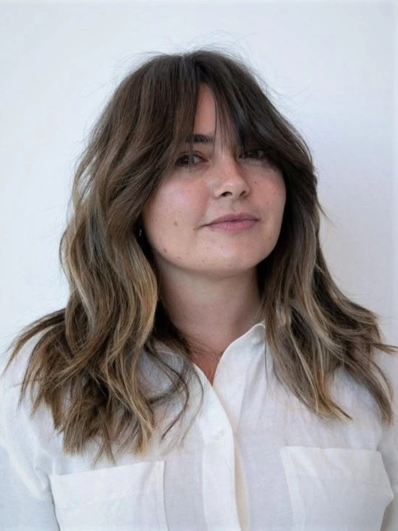 Long Sun-Kissed Curtain Bangs