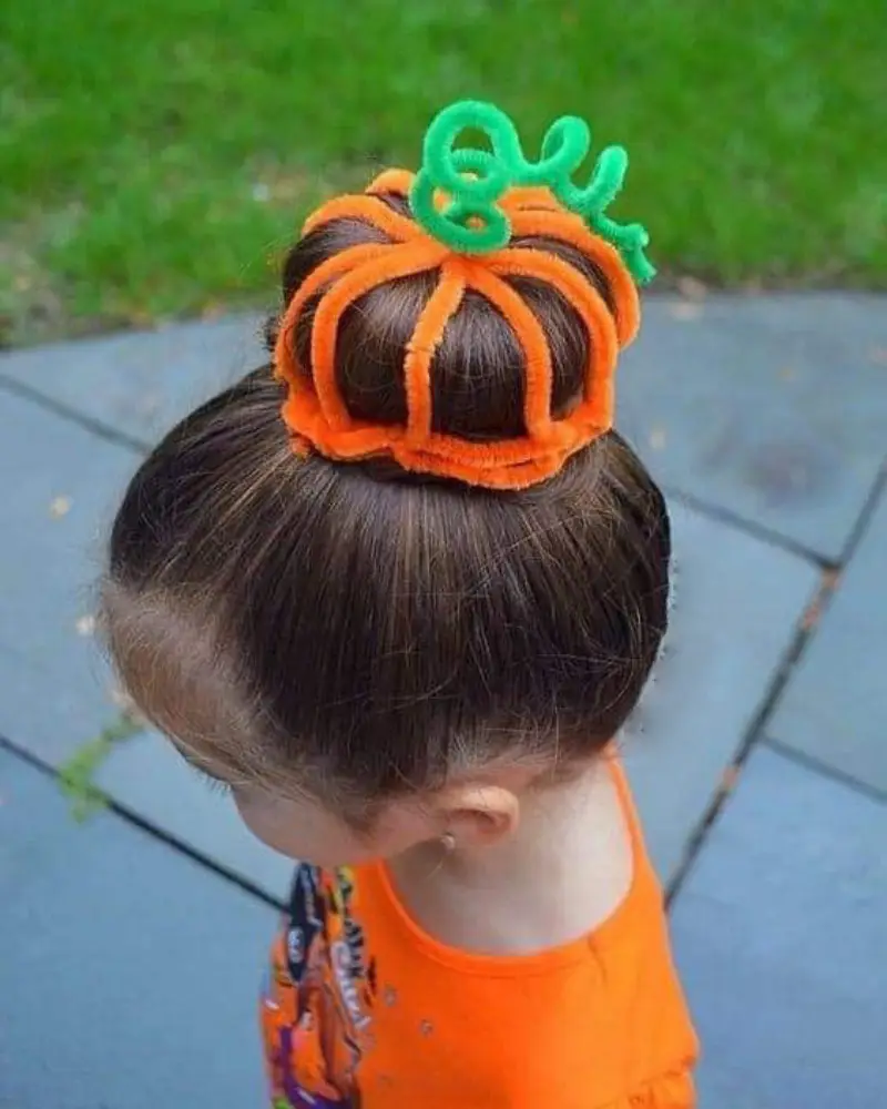 pumpkin cage bun halloween hairstyle for kids