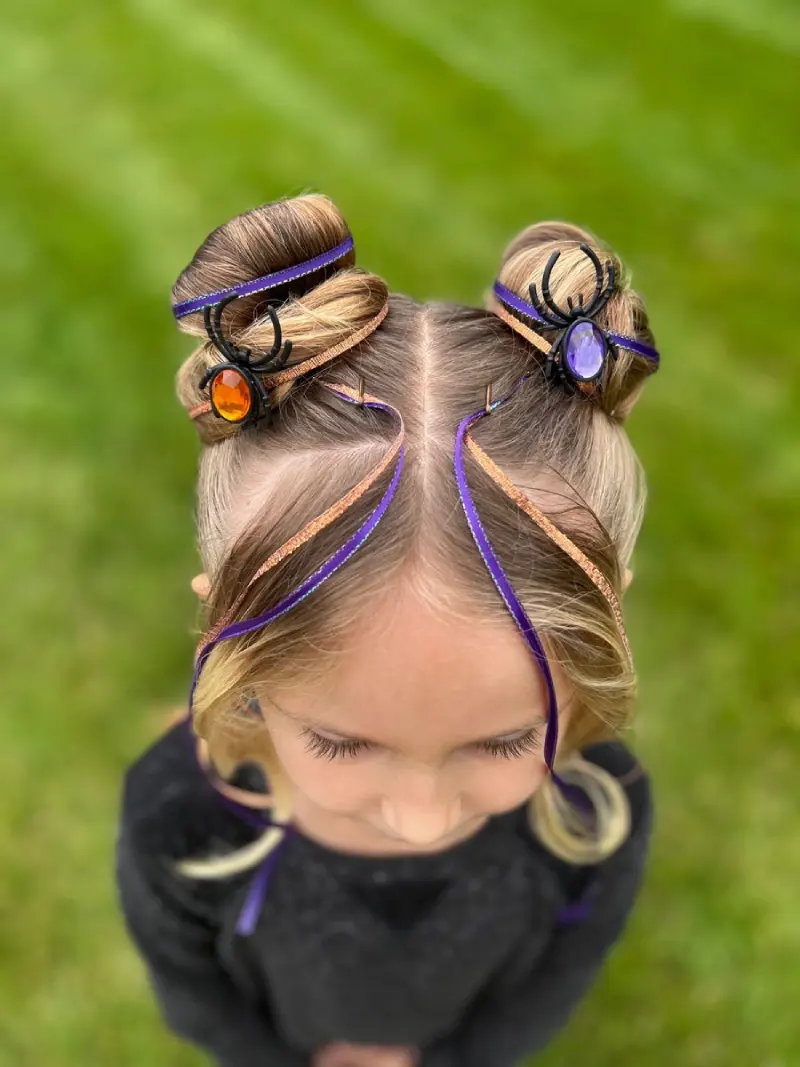 twisted spider bun pigtails halloween hairstyle for kids