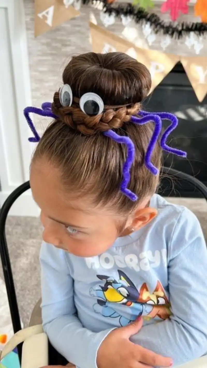 spiderweb bun style halloween hairstyle for kids