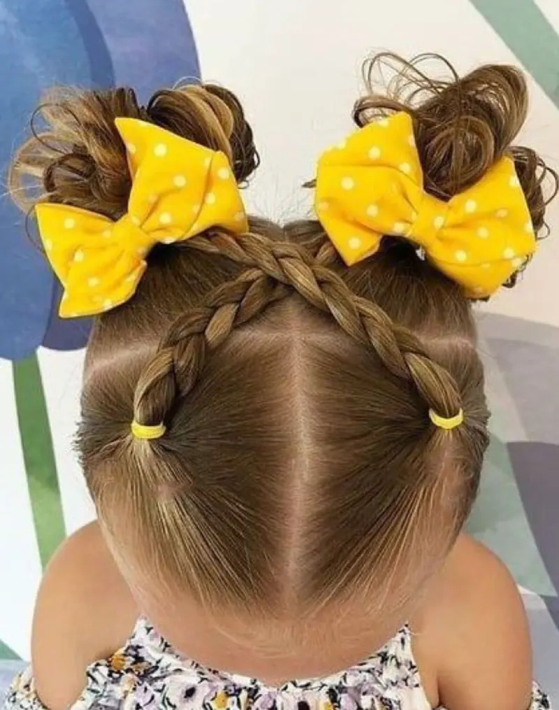 Double Bun with Yellow Bow School Hairstyle