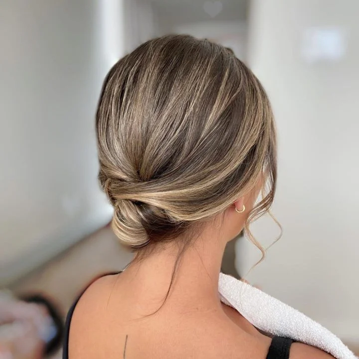 elegant low twisted bun winter formal hairstyles
