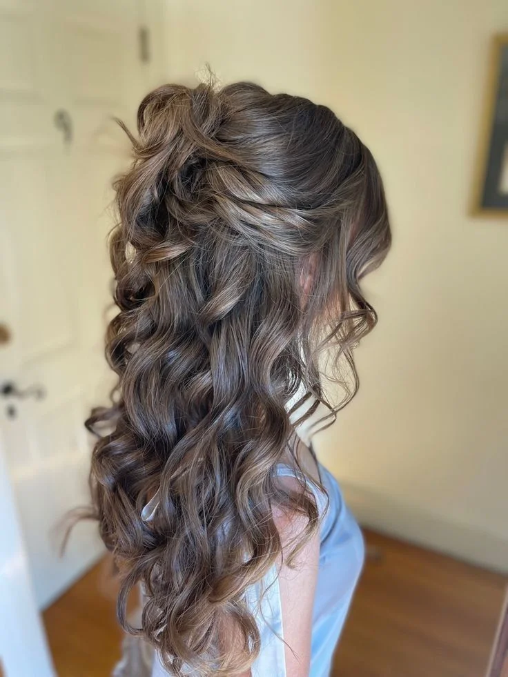 loose curly half-up  winter formal hairstyles